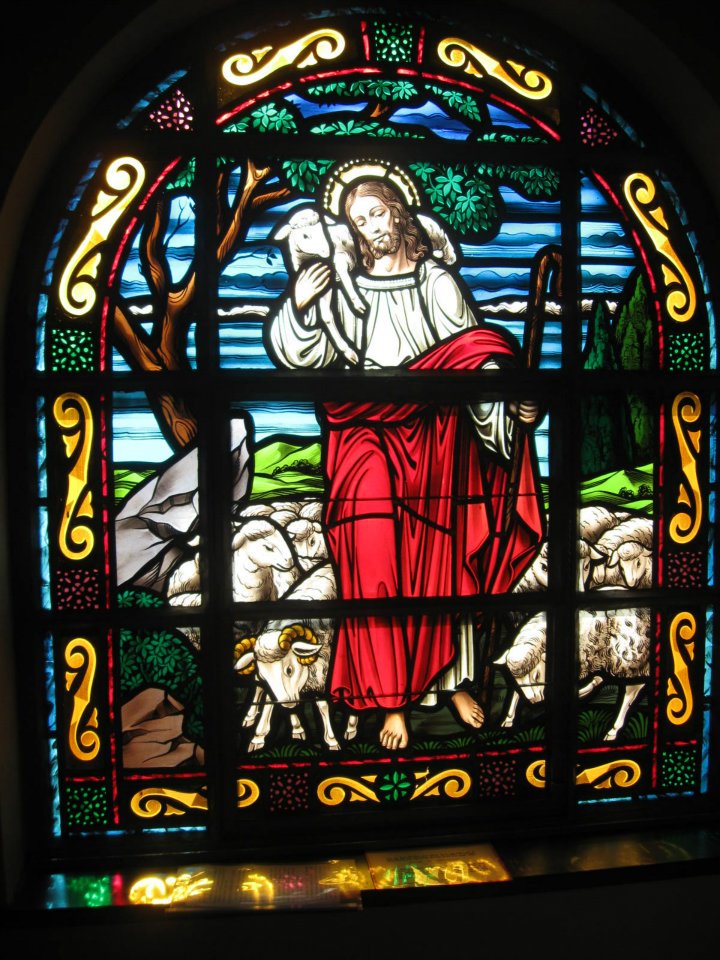 The Good Shepherd stained glass window in the Confessional