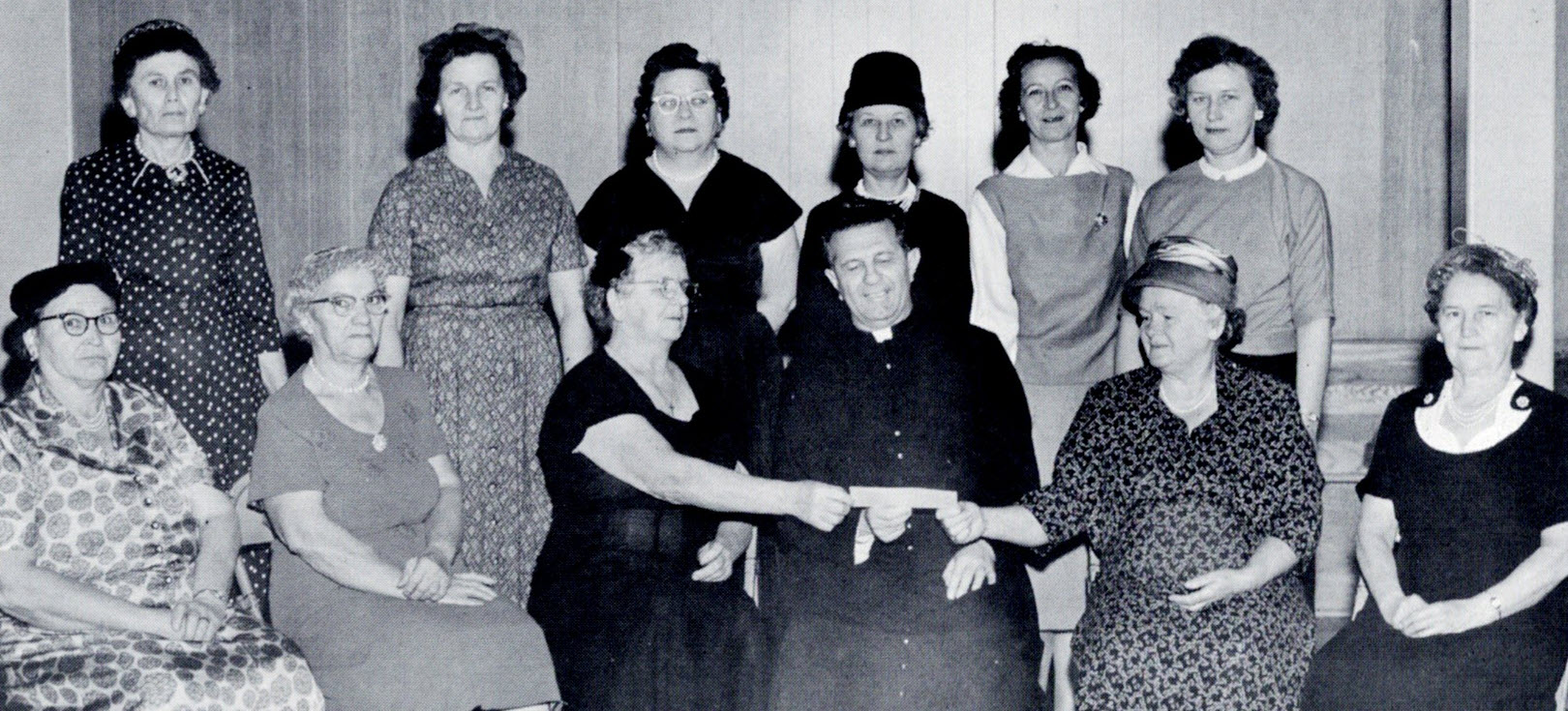 Ladies presenting check for parking lot "pirohi' sales